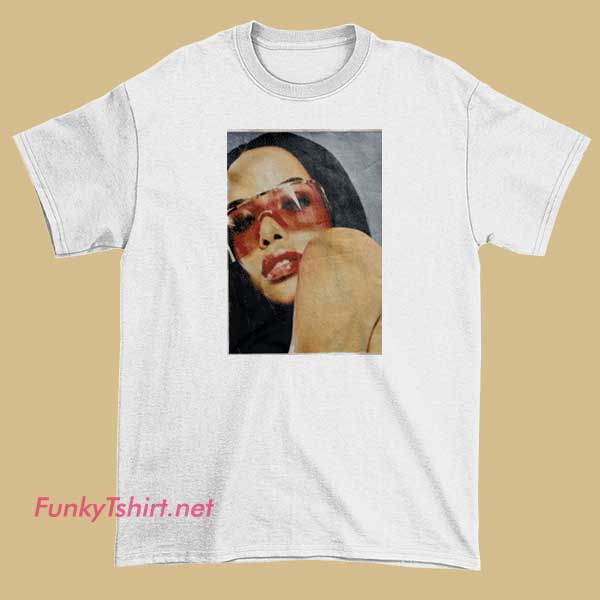 A T-shirt featuring Aaliyah sporting iconic red glasses and a stylish look.